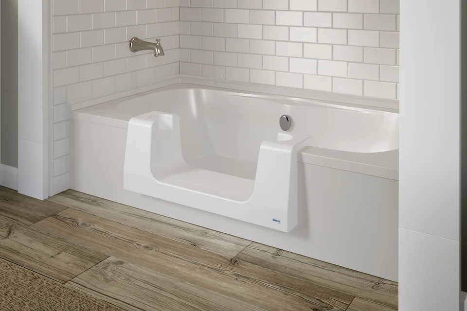Convertible bathtub insert with the center plug removed for lower shower access.